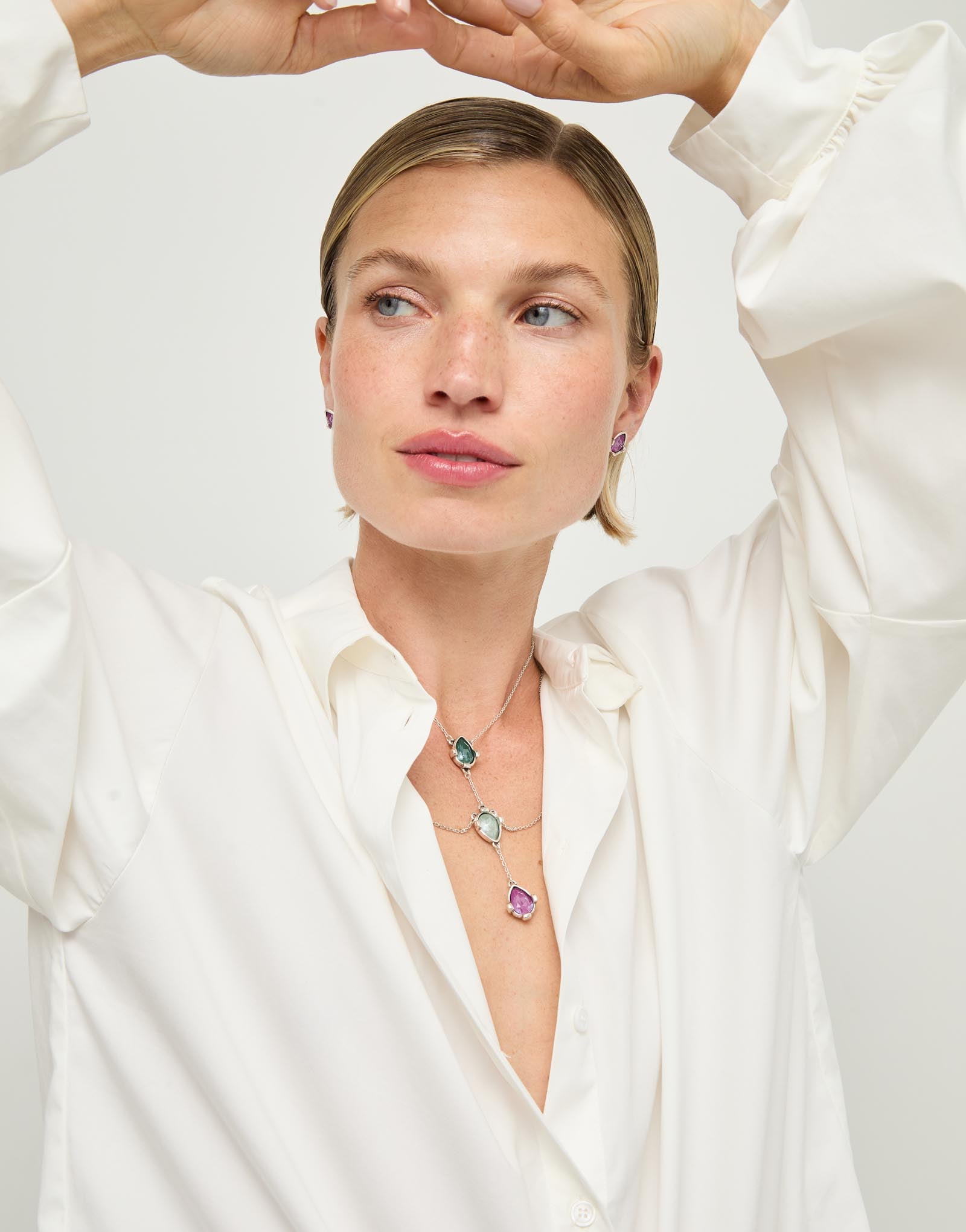 Double necklace with three drop-shaped pendants featuring multicoloured faceted crystals