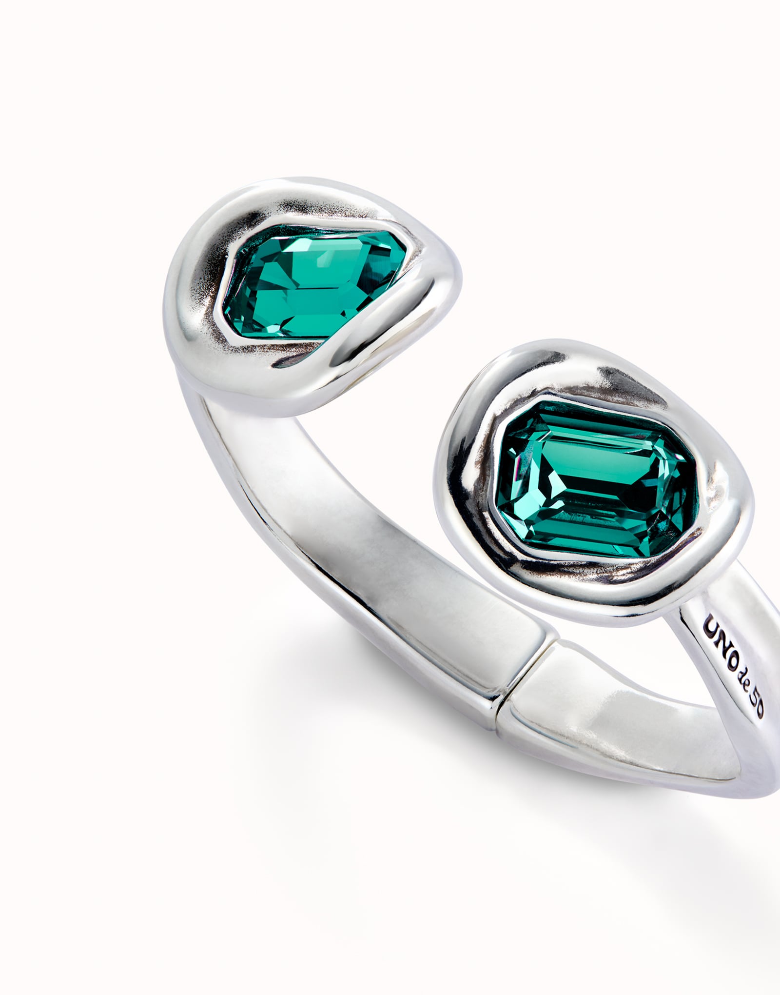 Bangle bracelet with two green crystals