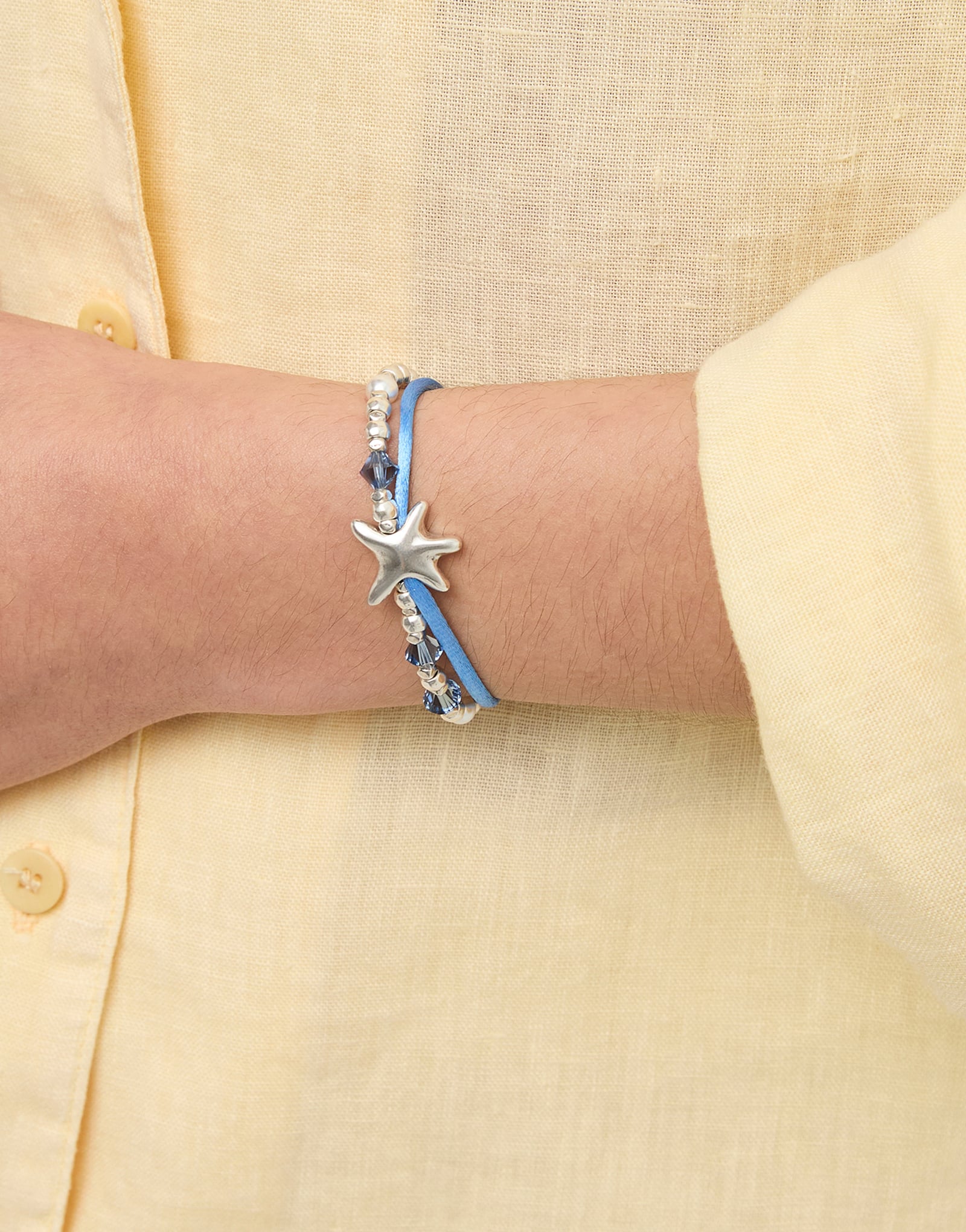 Blue silk thread and metal bracelet with starfish