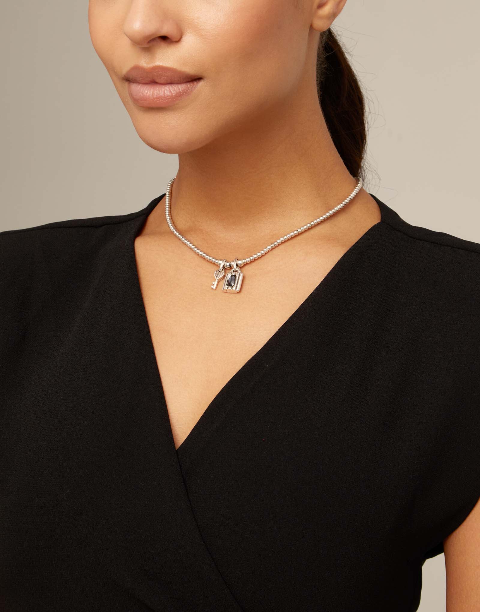 Colgante de plata con 2 charms de llave y candado