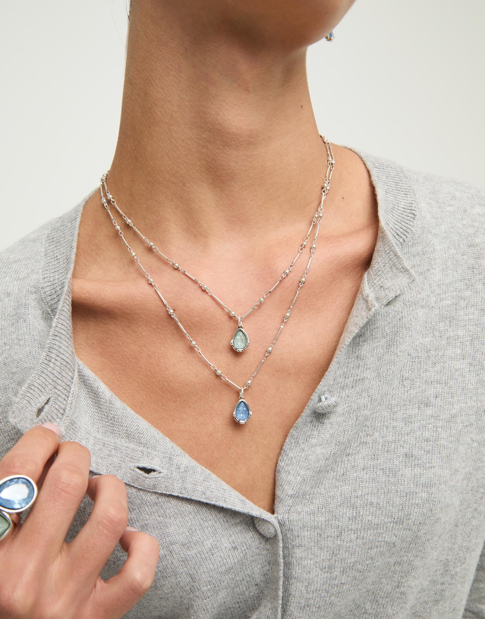 Double necklace with two blue drop-shaped faceted crystals