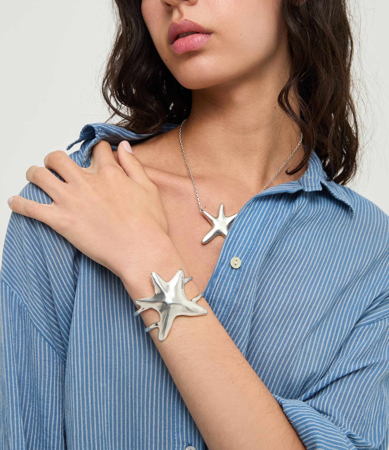 Pulsera r&iacute;gida doble ba&ntilde;ada en plata estrella de mar