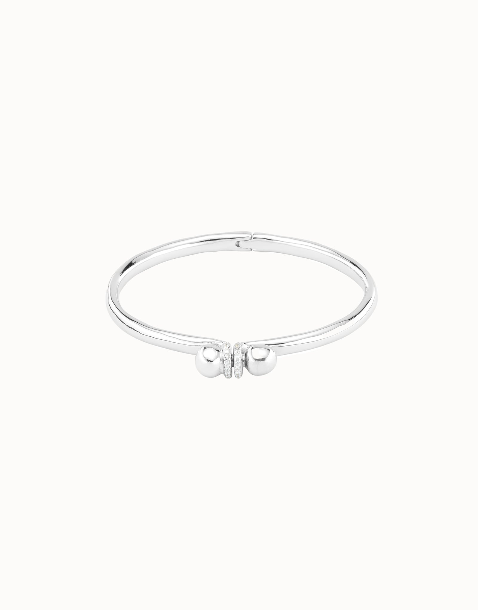 Pulsera r&iacute;gida ba&ntilde;ada en plata con topacios