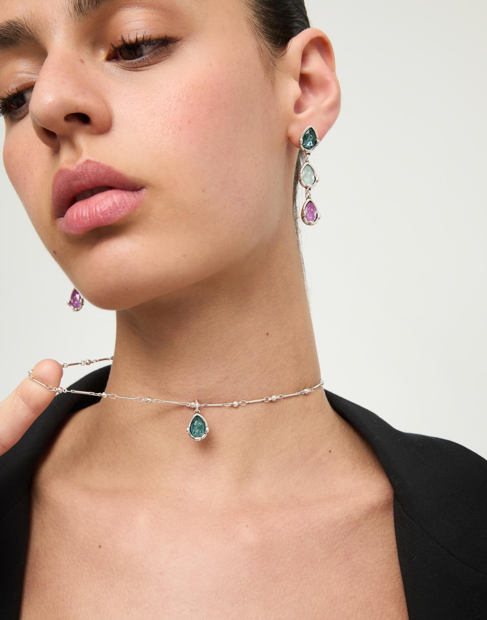 Necklace with a green drop-shaped faceted crystal