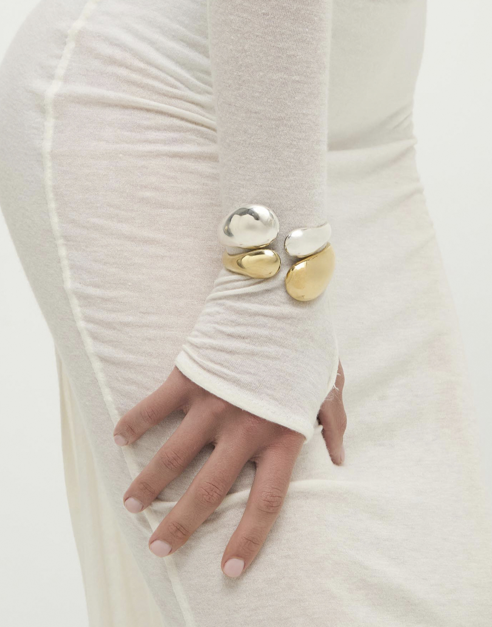 Bangle bracelet with two irregular drops