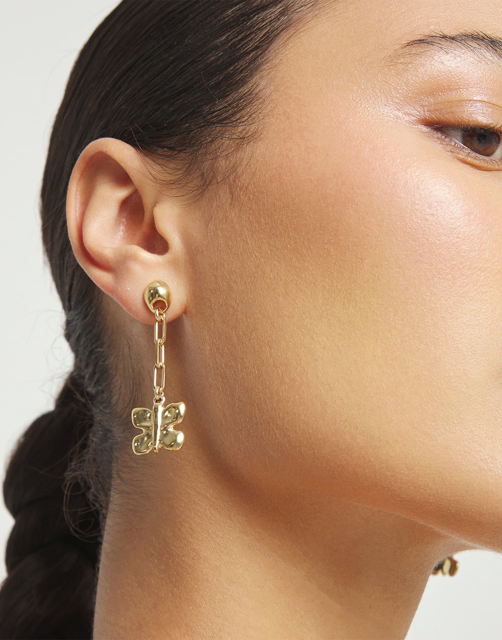 Drop earrings with a butterfly-shaped ornament