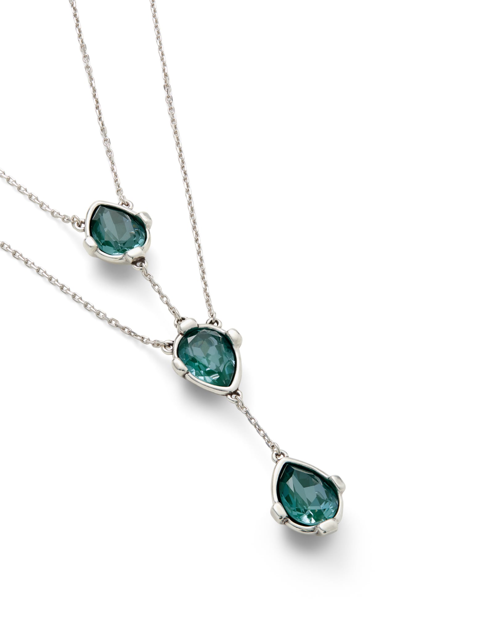 Double necklace with three drop-shaped pendants featuring green faceted crystals